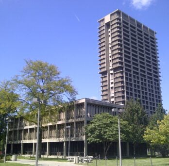 University Hall, surrounded by trees
                  